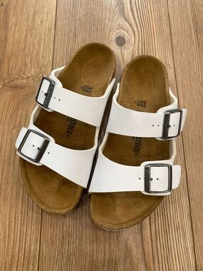 Birkenstock White Two-Strap Arizona Sandals with Silver Buckles